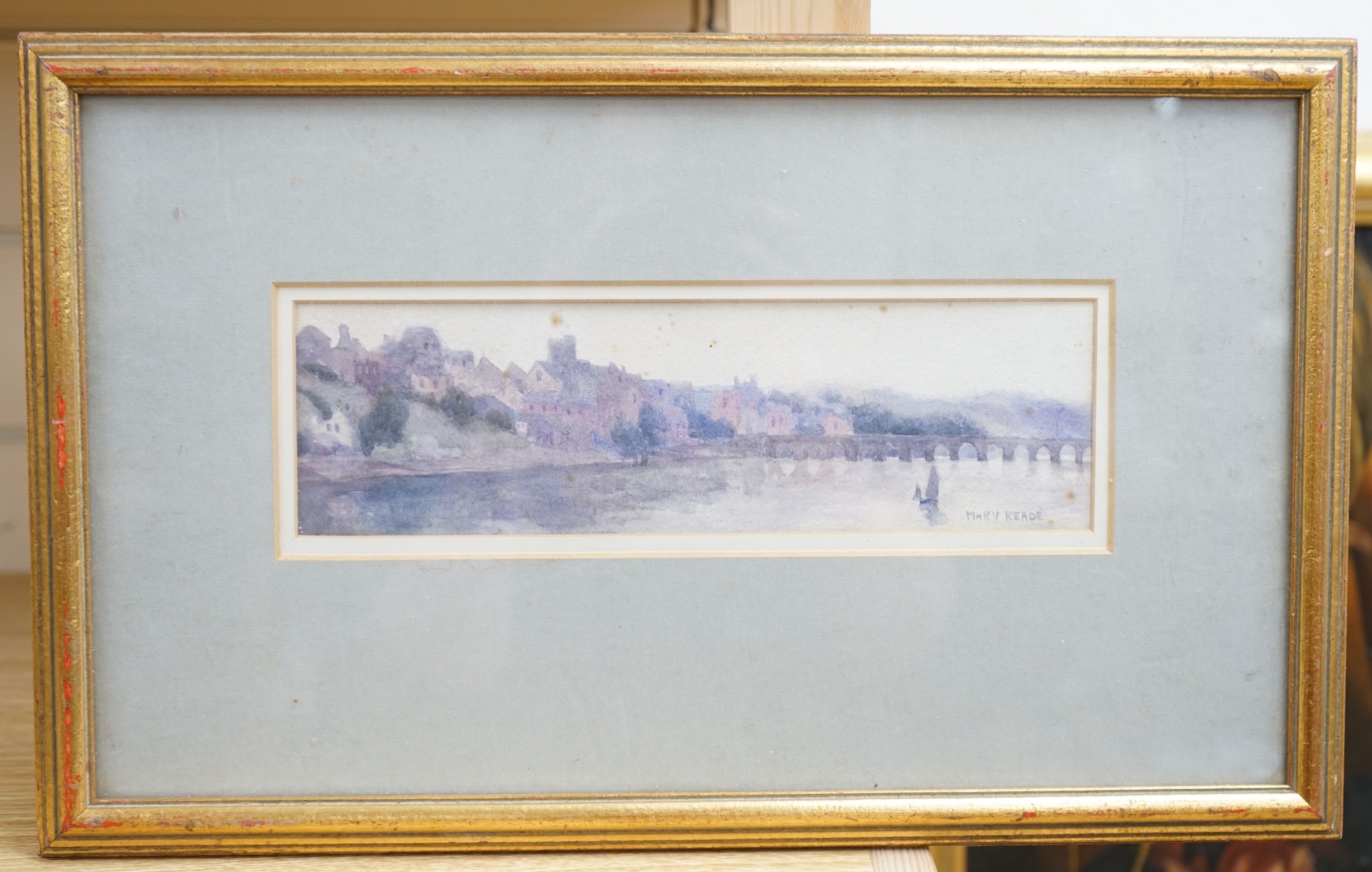 Mary Reade (Exh. 1882-1933), watercolour, View of a riverside town, signed, 7 x 25cm